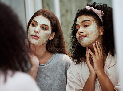 Buy stock photo Women, home skincare or face mask bonding in house, bathroom or hotel for spa wellness, girls hospitality or healthcare grooming. Friends, people or beauty facial product for luxury wellness cleaning