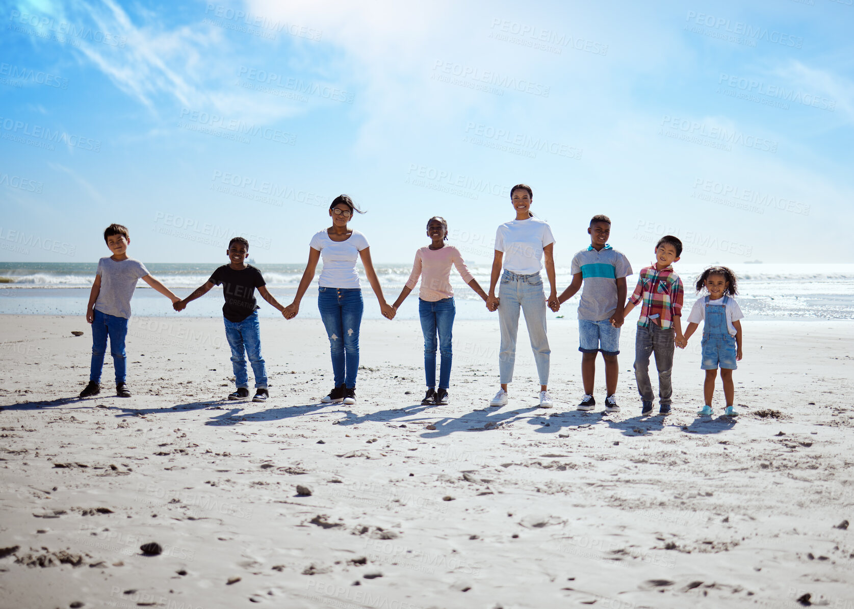 Buy stock photo Beach, holding hands and lesbian women with children for support, holiday diversity and big family love in Indonesia. Trust, hope and portrait of parents with kids for a travel vacation at the sea