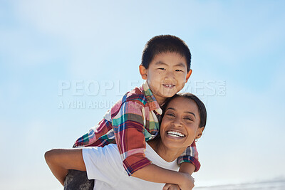Buy stock photo Mother, beach piggyback and child in portrait, interracial family bonding and outdoor vacation in sunshine. Happy family, asian boy and black woman for adoption, love and ride game on ocean holiday