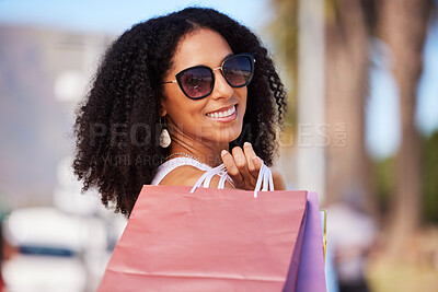 Buy stock photo Happy, retail and black woman with shopping bag portrait and smile in sunny Los Angeles, USA. Happiness, consumerism and trendy fashionista girl with shopping bags for stylish lifestyle.

