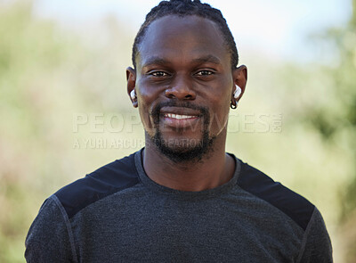 Buy stock photo Fitness, black man and portrait of happy runner, earphones and training exercise in Nigeria park. Face, smile and sports athlete listening to music for motivation, healthy goals and wellness workout
