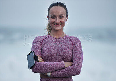 Buy stock photo Portrait, runner and woman with arm band, music earphones and motivation for cardio fitness in Sweden. Happy young athlete, arms crossed and training for healthy lifestyle, energy and sports wellness