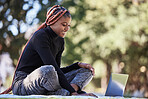 Black woman, laptop and relax outdoor picnic for college studying, happy learning and digital education. Nature park, young African girl smile and reading university communication online in sunshine