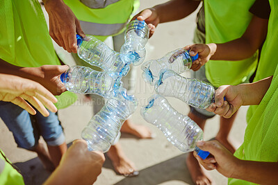 Buy stock photo Hands group, circle and plastic bottles in beach waste management, community service and climate change volunteering. Kids diversity, teamwork and trash cleaning in environment sustainability recycle