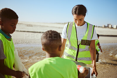 Buy stock photo Recycle, education and woman with children group at beach cleaning in sustainability, green environment or eco friendly ocean. Friends, teacher volunteer and recycling box for pollution or earth day