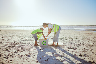 Buy stock photo Recycle, plastic and woman with child in beach cleaning support for sustainability, green environment or eco friendly ocean. Mother or volunteer family help with box at sea for pollution or earth day