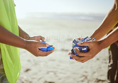 Buy stock photo Cleaning, plastic and hands of volunteer at beach for recycle, environment or earth day. Recycling, sustainability and climate change with charity teamwork and trash for pollution and eco friendly