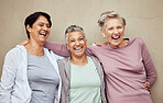 Senior women, exercise and laughing for fitness, workout or happiness of healthy lifestyle together. Mature female friends relax after training, wellness and funny retirement group on wall background