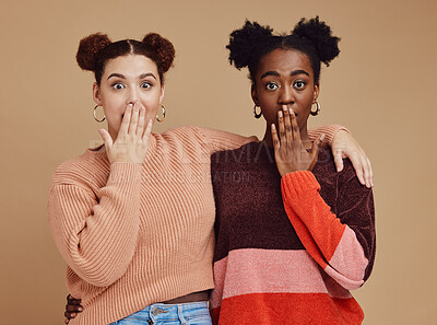 Buy stock photo Surprise, portrait and girl friends with wow face of young women with secret and brown studio background. Gen z student surprised chat together with whisper and excited discussion with shock story