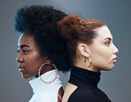 Fashion, hair care and women with futuristic diversity, cyberpunk aesthetic and isolated on a studio background. Future, creative and models modeling for a designer brand with a vision on a backdrop