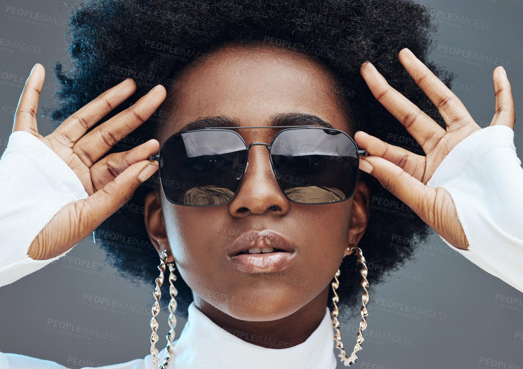 Buy stock photo Face zoom, sunglasses and fashion with black woman, style and designer with trendy brand and gen z hands against studio background. Jewelry, edgy and girl, marketing with fashion model and beauty