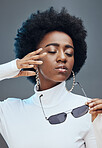 Beauty, cosmetics and black woman with sunglasses in studio for stylish clothes, makeup and luxury style. Fashion model, designer brand and confident girl with accessories, trendy and edgy jewellery