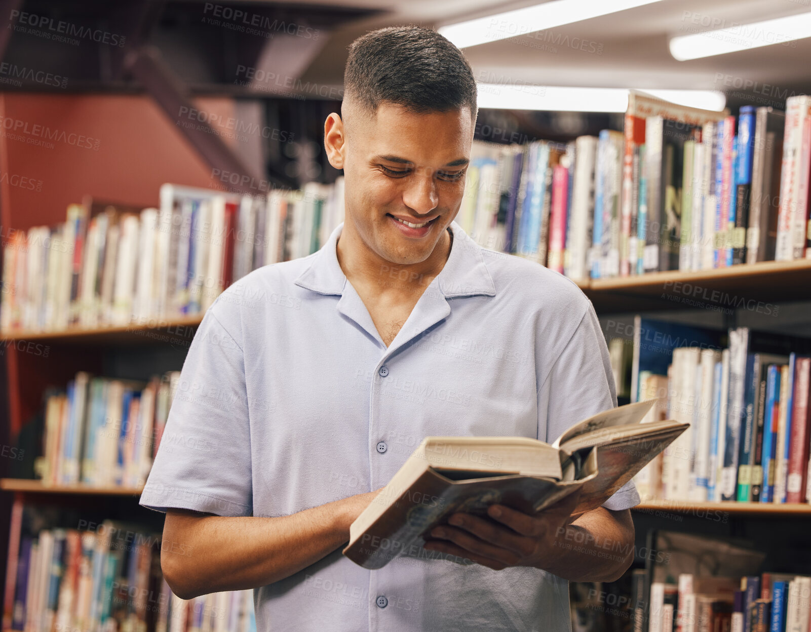 Buy stock photo Happy student, reading or library books in education, learning or studying for university, college or school degree. Smile, man or bookstore customer in textbook research for scholarship degree goals