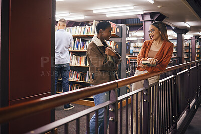 Buy stock photo Students, college library and women talking about books, education and learning together at university. Friends having conversation about knowledge, studying and research to study with scholarship