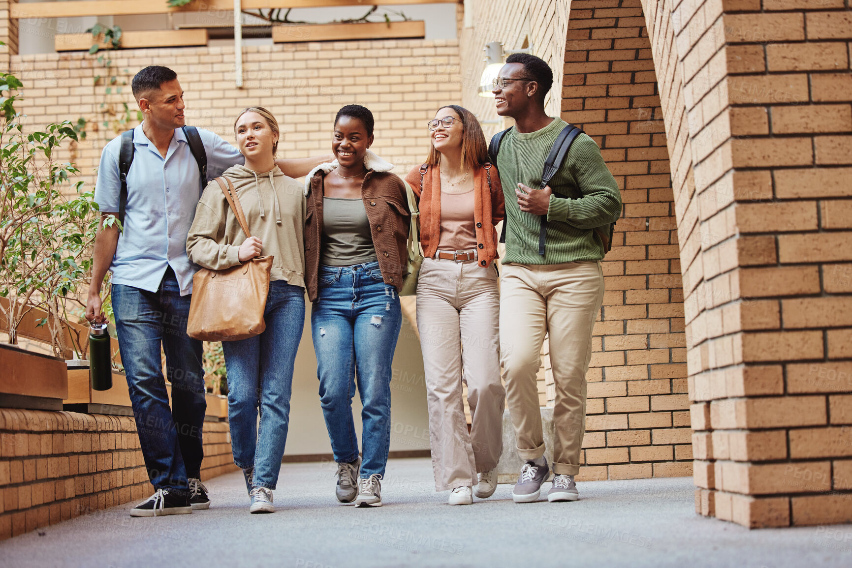 Buy stock photo Walking men, women and people on university, school or college campus to education, diversity learning and study class. Smile, happy and talking students in community support, group trust and bonding