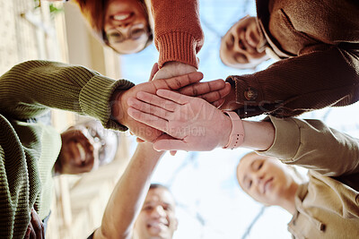 Buy stock photo Below, hands stack and group of students for motivation, support or education in summer sunshine. Diversity, hand together and learning with teamwork, studying or scholarship at university for future