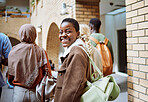 Black woman, happy or portrait on university, school or college campus with friends, people or global study group. Smile, face or diversity students walking to education class or learning buildings