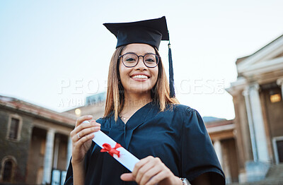 Buy stock photo Portrait, graduate and study with a student woman holding a diploma or certificate outdoor on graduation day. Education, goal or unviersity with a female pupil outside after scholarship success