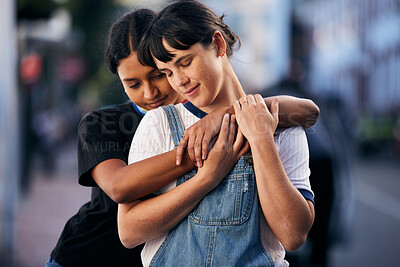 Buy stock photo Support, hug and lgbt couple in the city with peace, freedom and love for identity in France. Pride, calm and lesbian women friends hugging for comfort and relax in lgbtq relationship in the street