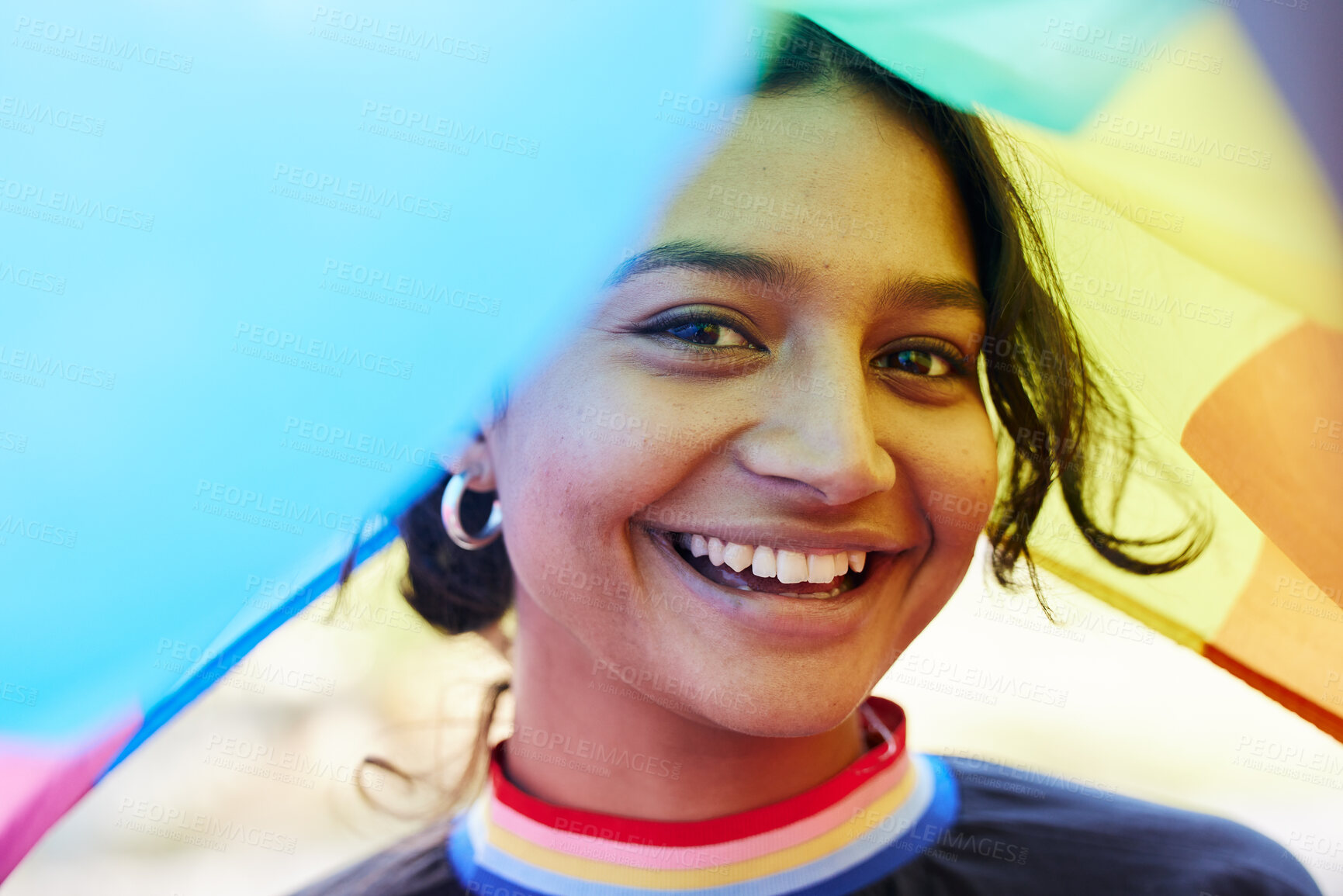 Buy stock photo Rainbow, flag and portrait with an indian woman in celebration of lgbt equality, freedom or gay pride. Community, support or human rights with a gender neutral or non binary female celebrating lgbtq