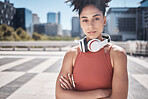 Fitness, headphones and black woman in portrait for workout, exercise or training motivation, mental health and wellness in city. Face of a sports athlete with music audio subscription or technology