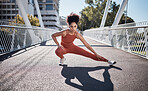Stretching legs, fitness portrait and woman on city bridge exercise, runner and training in sports shoes fashion. Warm up, focus and urban athlete on ground workout for body, muscle and health goals