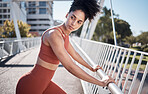 Black woman, fitness and stretching in the city for running exercise, workout or training preparation. Active African American woman in warm up stretch getting ready for run or healthy cardio in town