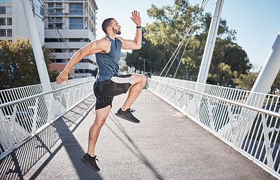 Buy stock photo Fitness, running and exercise with a sports man on a bridge in the city for a cardio or endurance workout. Health, runner and training with a male athete exercising in an urban town for wellness