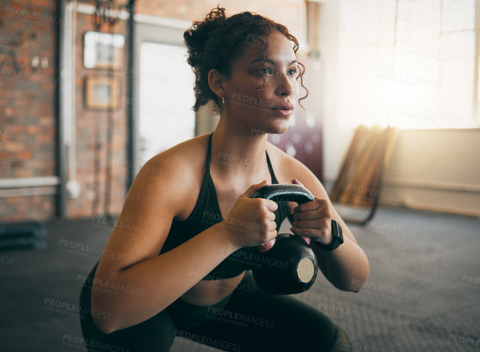 Buy stock photo Exercise, kettlebell and a woman at gym breathing during workout, exercise and weight training for body wellness. Strong sports female or athlete with weights for power, muscle and healthy lifestyle