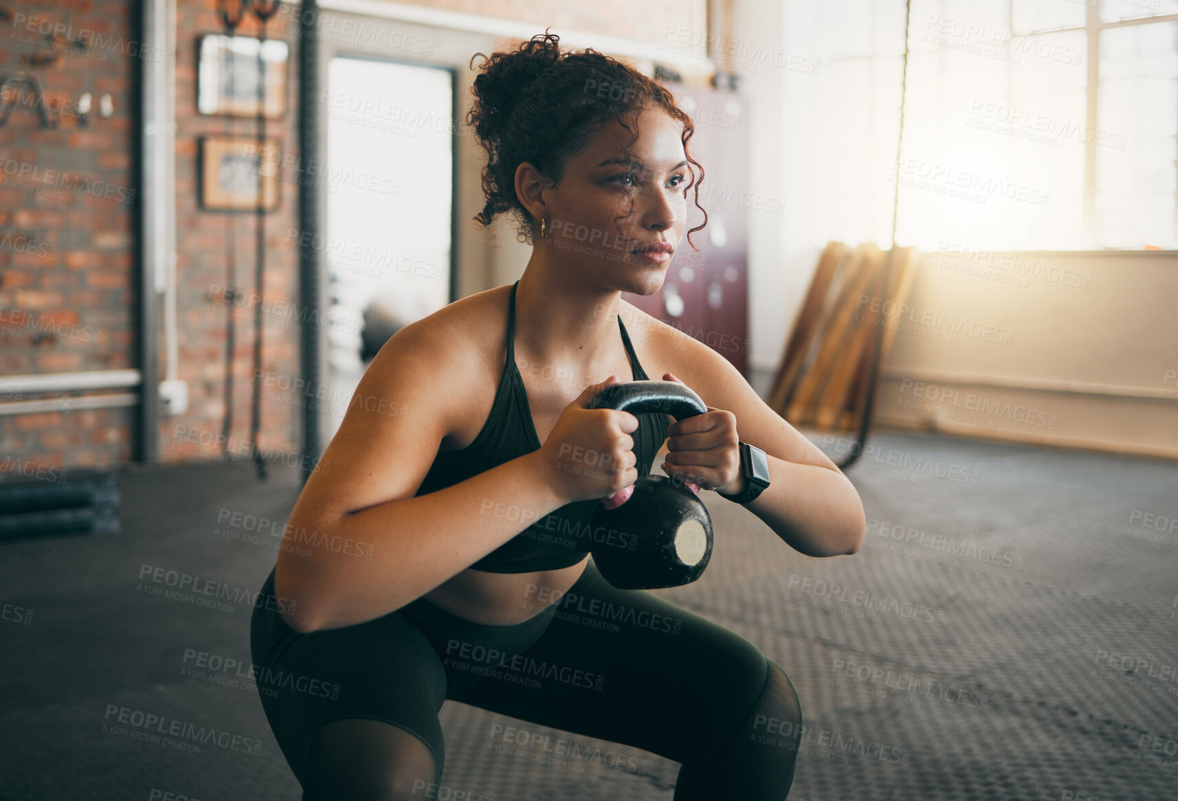 Buy stock photo Fitness, kettlebell and a woman at gym doing workout, exercise and weight training for body wellness and muscle. Strong sports female or athlete with weights for power, energy and a healthy lifestyle