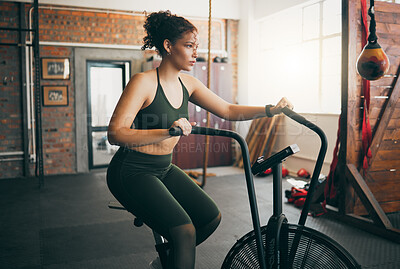 Buy stock photo Exercise bike, fitness and woman at gym for workout, cardio training and cycling for energy, balance and lose weight. Sports female or athlete with spinning machine for health, wellness and self care