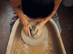 Hands, pottery and clay mold in the workshop for art, design or creative small business startup. Hand of employee artist in craft, molding or shaping with ceramics for creativity at the workplace