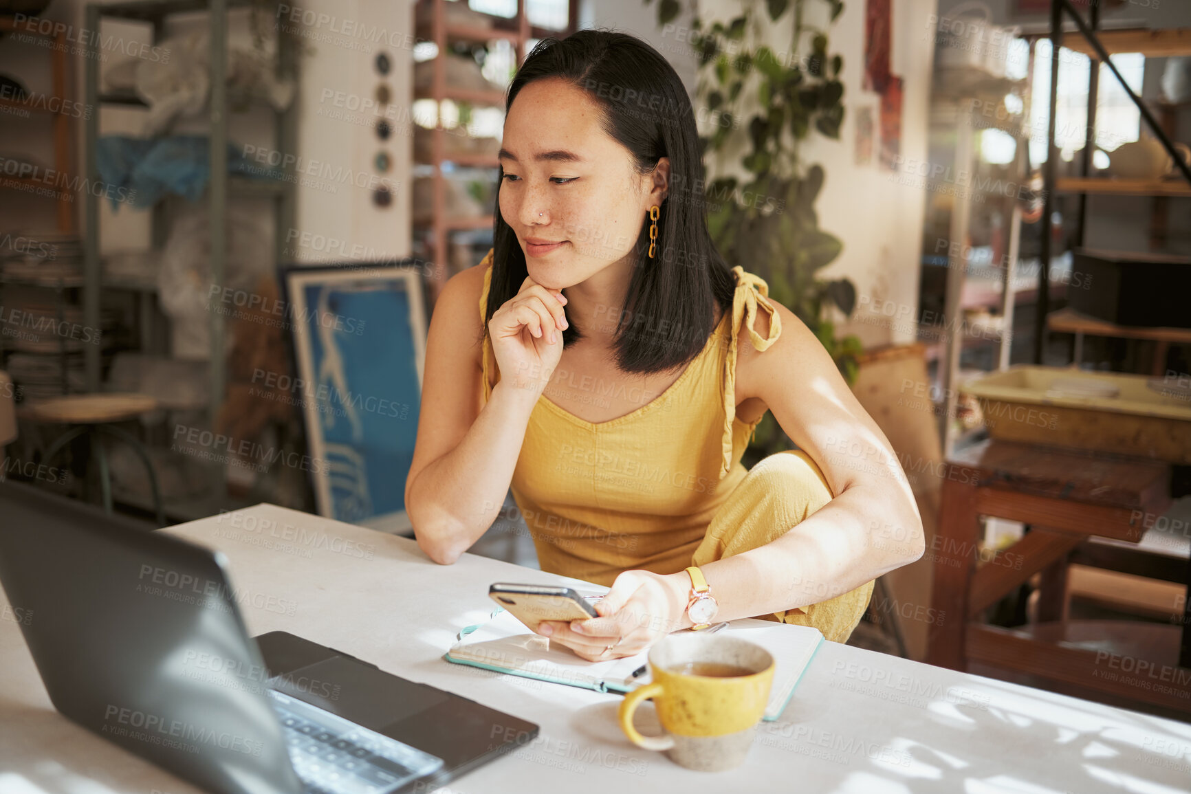 Buy stock photo Asian woman, laptop and phone thinking in small business marketing, advertising or retail planning at the workshop. Creative woman contemplating business startup or market strategy plan on computer