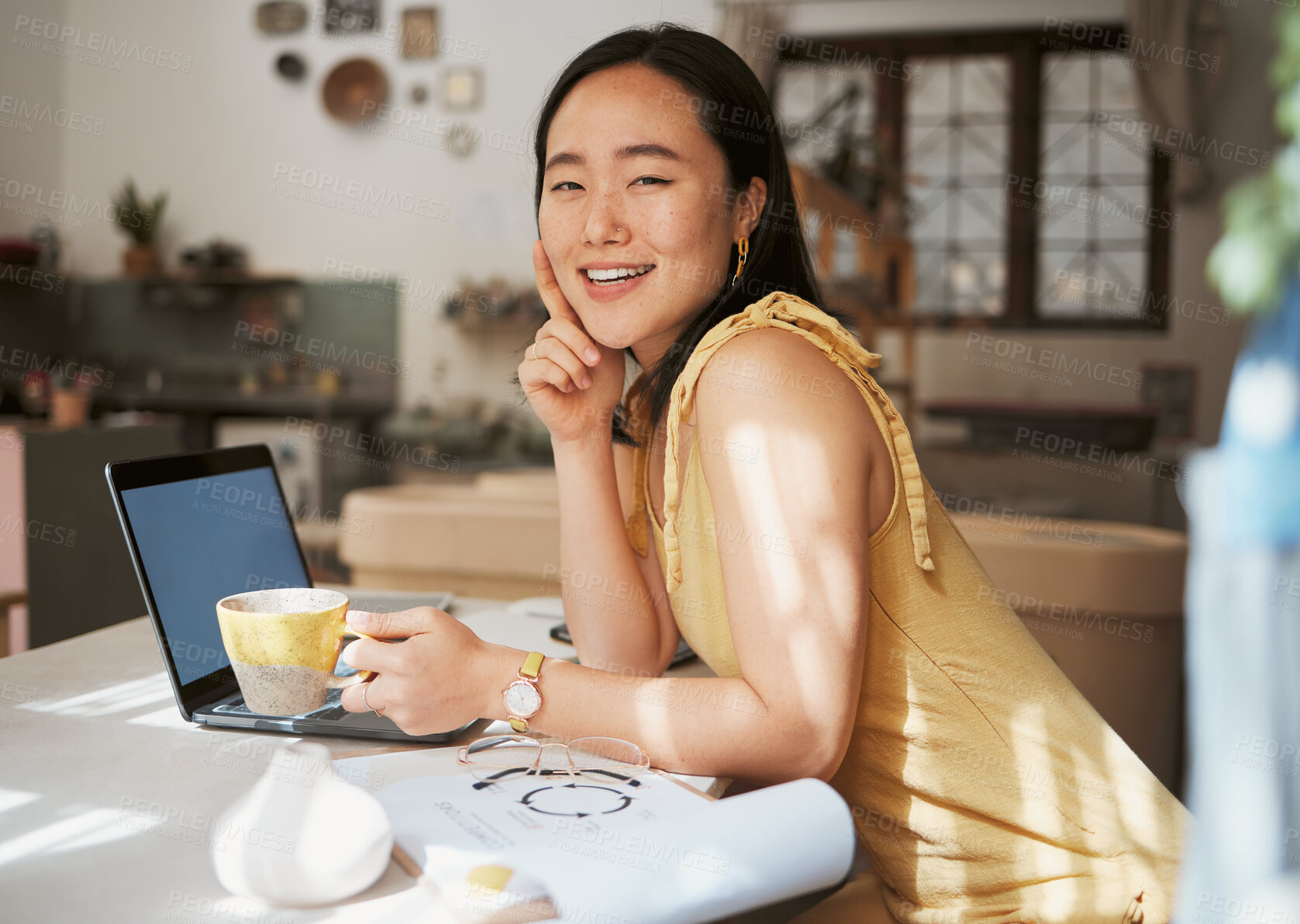 Buy stock photo Asian woman, laptop and portrait for business happiness with coffee in ceramics workshop, artist studio or success vision. Woman, creativity office and planning strategy on digital tech in morning