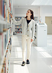 Woman, student and search in library for book choice, knowledge or learning at bookstore for education. Female looking at bookshelf in study for decision, thinking or choosing thesis for scholarship