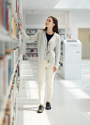 Buy stock photo Woman, student and search in library for book choice, knowledge or learning at bookstore for education. Female looking at bookshelf in study for decision, thinking or choosing thesis for scholarship