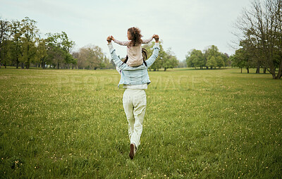 Buy stock photo Mother, child and piggyback in the nature countryside for bonding relationship, freedom or weekend travel. Mom holding daughter on back playing together for fun in the park on the open green field