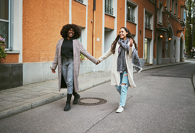 Buy stock photo Love, holding hands and lesbian couple walking in street enjoying holiday, vacation and adventure. Fashion, lgbtq relationship and women together for happy interracial marriage, freedom and relaxing