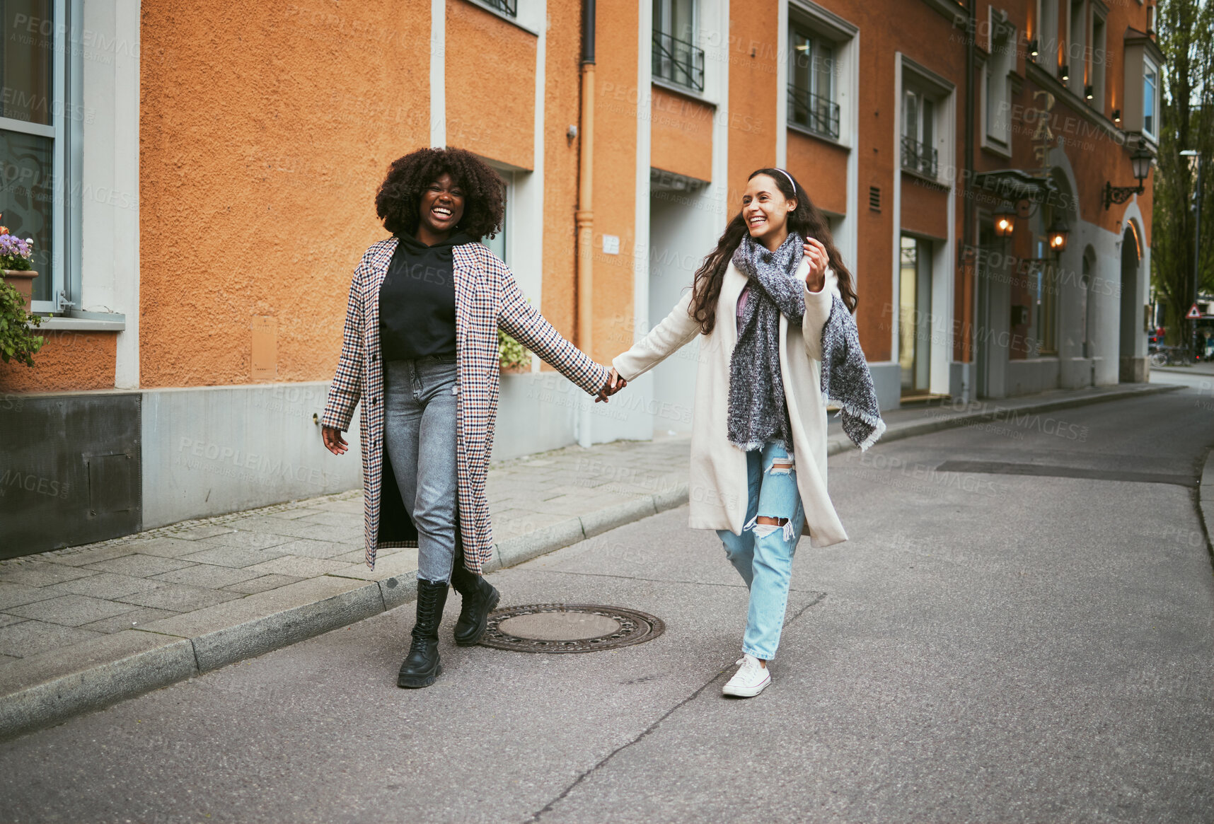 Buy stock photo Love, holding hands and lesbian couple walking in street enjoying holiday, vacation and adventure. Fashion, lgbtq relationship and women together for happy interracial marriage, freedom and relaxing