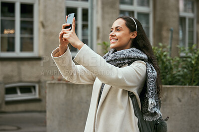 Buy stock photo Travel, tourism and phone with a woman in the city taking a photograph while traveling on holiday or vacation. Tourist, traveler and mobile with a female photographing while sightseeing abroad