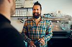 Man, barista helping customer and service in coffee shop, conversation and friendly entrepreneur. Guy, male employee or assist client in cafe, talking or order tea with successful business or startup