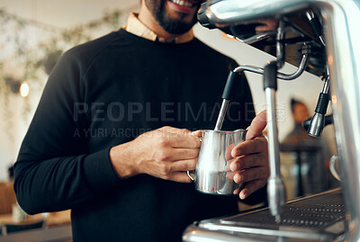 Buy stock photo Hands, barista and brewing coffee in kitchen using machine for hot beverage, caffeine or steam. Hand of employee male steaming milk in metal jug for premium grade drink or self service at cafe