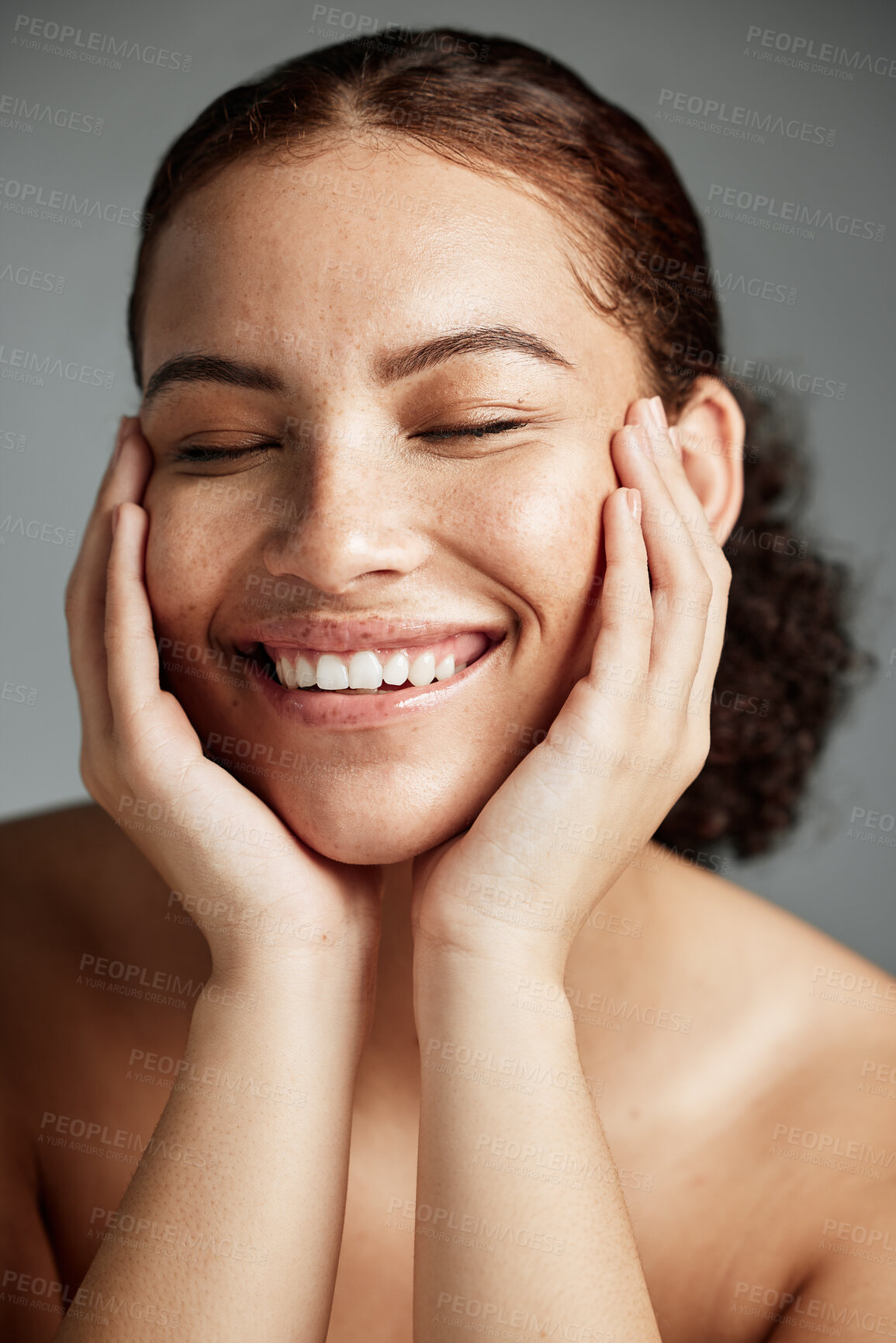Buy stock photo Face, skincare and makeup with a model black woman in studio on a gray background to promote natural care. Facial, wellness and makeup with an attractive young female happy with her cosmetic product