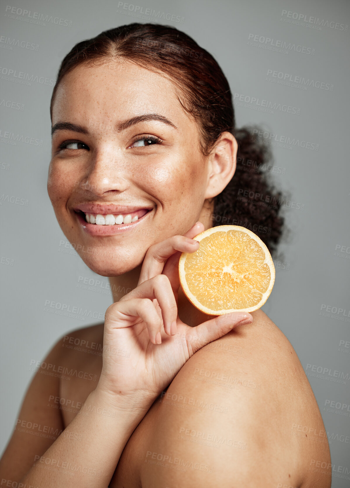 Buy stock photo Woman, happy and orange in studio for skincare, wellness and beauty with cosmetic glow, self care and backdrop. Model, black woman and fruit for aesthetic, detox or healthy natural skin by background