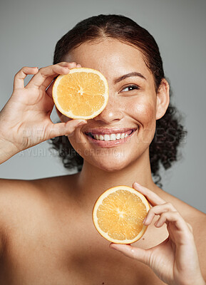 Buy stock photo Woman, smile and orange in studio for skincare, health and wellness with cosmetic glow, self care and backdrop. Model, black woman and fruit for cosmetics, detox or healthy natural skin by background