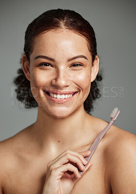 Buy stock photo Brushing teeth, toothbrush and a woman portrait while happy about dental hygiene and teeth whitening. Face of a female with a smile for oral health, healthy mouth and self care on studio background