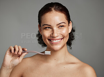 Buy stock photo Dental smile, toothbrush and woman brushing teeth for hygiene, cleaning and teeth whitening in studio. Happy female face on grey background for oral health, healthy mouth and self care for wellness