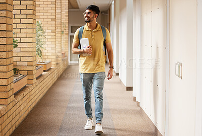 Buy stock photo University student, college and indian man walking with a smile and backpack down campus corridor. Gen z male happy about education, learning and future after studying with scholarship at school