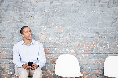 Buy stock photo Recruitment, thinking and black man on brick wall or waiting room with career dream, opportunity or job search. Happy person sitting in line with smartphone for hiring news, interview and cv ideas