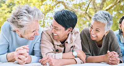 Buy stock photo Retirement, women and friends laugh at park together for bonding, wellness and relaxing lifestyle. Happiness, funny and smile of senior people in interracial friendship on blanket in nature.

